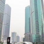 Caravan in China in front of a big building