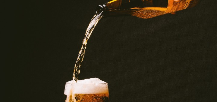 beer is being filled into a glass