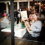 crazy women at a restaurant holding their menus up