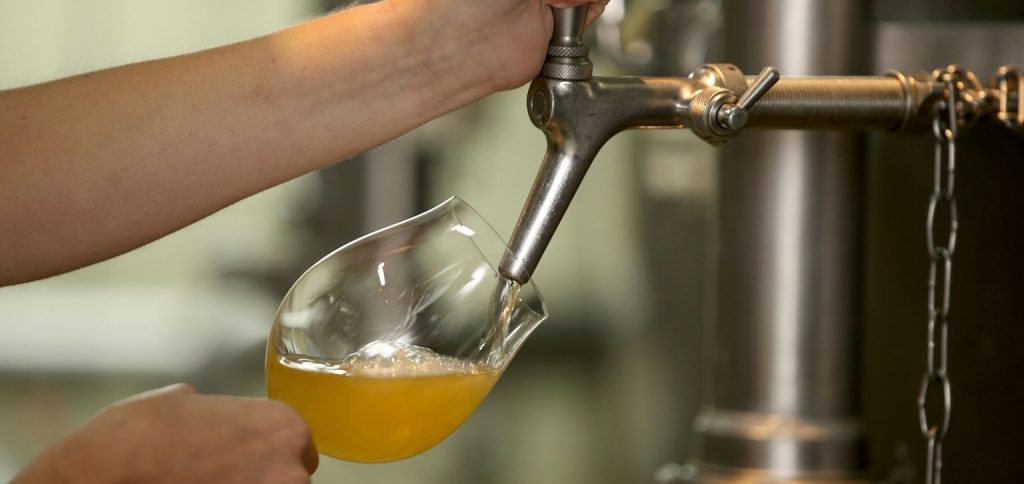 A person tapping beer