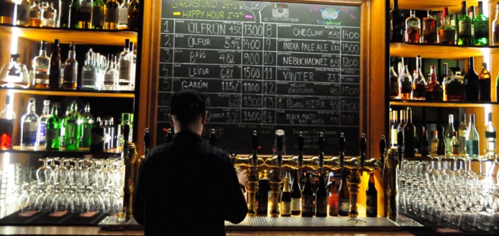 A stylish bar and a bar keeper working