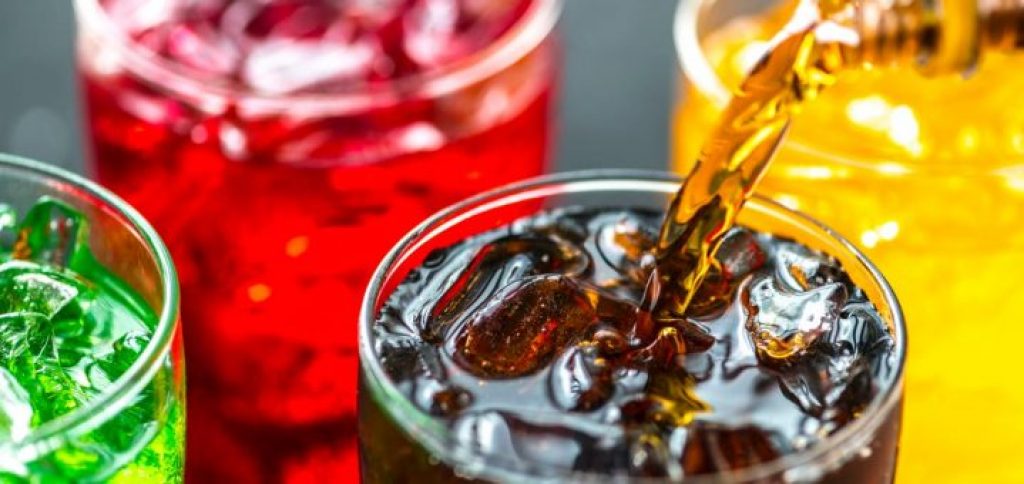 Several glasses with colorful softdrinks